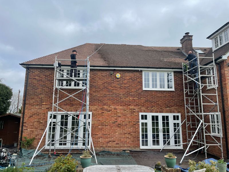 Roof cleaning carried out safely from scaffold towers by The Roof Moss Cleaners in Fordingbridge